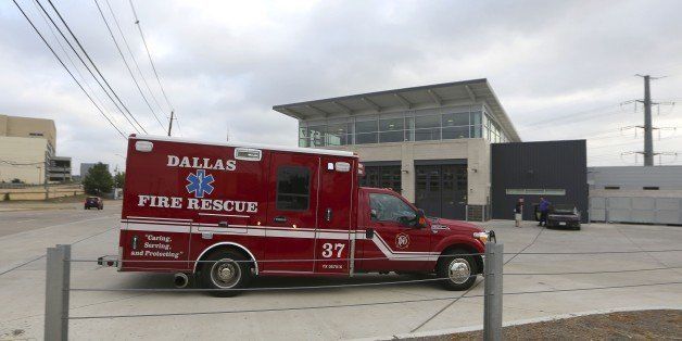 An ambulance pulls into the Dallas Fire-Rescue station 37 in Dallas, Wednesday, Oct. 1, 2014. Three EMT's from this location are under a 21 day quarantine after a patient they transported tested positive for Ebola. (AP Photo/LM Otero)