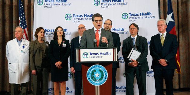 DALLAS, TX - OCTOBER 01: Texas Govenor Rick Perry answers questions related to the first confirmed case of the Ebola virus at Texas Health Presbyterian Hospital Dallas on October 1, 2014 in Dallas, Texas. State and local officials are working with federal officials to monitor other individuals that had contact with the confirmed patient. (Photo by Tom Pennington/Getty Images)