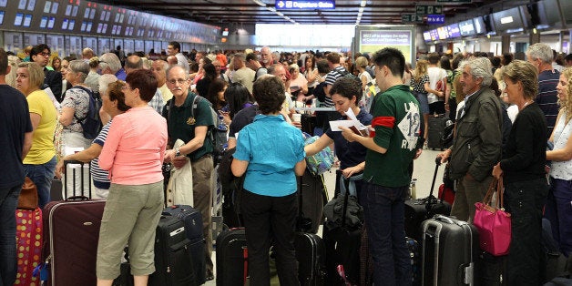 LUTON, ENGLAND - SEPTEMBER 08: A view of the crowds of people waiting to get a flight at London Luton Airport after a 'suspect package' was found on September 8, 2014 in Luton, England. Bedfordshire Police said that a suspect package was destroyed in a controlled explosion which took place at 17:15 after which the airport re-opened (Photo by Danny E. Martindale/Getty Images)