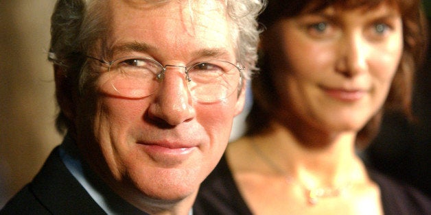 Richard Gere, left, a cast member in the new film "Chicago," and his wife Carey Lowell arrive at the premiere of the film in Beverly Hills, Calif., Tuesday, Dec. 10, 2002. (AP Photo/Chris Pizzello)