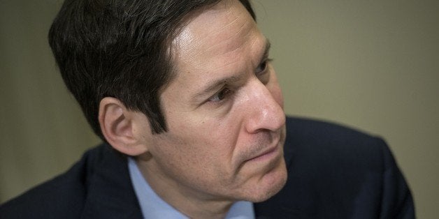 Dr. Tom Frieden, director of the Centers for Disease Control, listens while US President Barack Obama makes a statement to the press after a meeting in the Roosevelt Room of the White House October 6, 2014 in Washington, DC. Obama met with the national security team and senior staff on stopping the outbreak of Ebola. AFP PHOTO/Brendan SMIALOWSKI (Photo credit should read BRENDAN SMIALOWSKI/AFP/Getty Images)