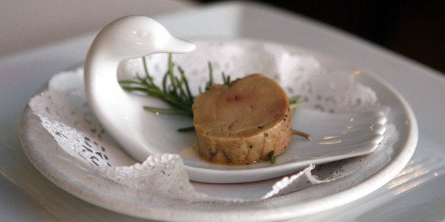 FILE - In this Wednesday, Aug. 9, 2006 file photo, a serving of salt-cured fresh foie gras with herbs is displayed at Chef Didier Durand's Cyrano's Bistrot and Wine Bar in Chicago. Back in 2005, the California legislature gave foie gras producers seven years to find a humane way to create the fatty duck liver delicacy without forcing food down the birdsￃﾢￂﾀￂﾙ throats. With the July 1, 2012 deadline looming, an attempt by some of the stateￃﾢￂﾀￂﾙs top chefs to overturn the law has the billￃﾢￂﾀￂﾙs original sponsor alleging that opponents have gone back on their word. A similar ban in Chicago was repealed in 2008. (AP Photo/M. Spencer Green)