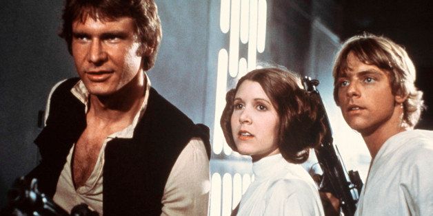 FILE - This file publicity image provided by 20th Century-Fox Film Corporation shows Harrison Ford, as Han Solo, Carrie Fisher, as Princess Leia Organa, and Mark Hamill, as Luke Skywalker. in a scene from the 1977 "Star Wars" movie released by 20th Century-Fox. (AP Photo/20th Century-Fox Film Corporation, File)