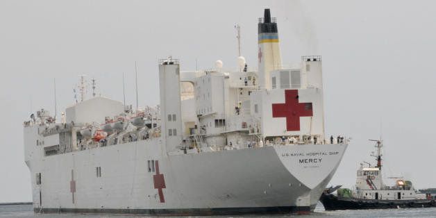 The berthing of USNS Mercy is seen at Manila's port on June 15, 2008. The ship, which is equipped with sophisticated medical equipment, is on a tour of various Philippine cities on a goodwill outreach mission providing humanitarian and civic assistance to the Filipino people. AFP PHOTO/Jay DIRECTO (Photo credit should read JAY DIRECTO/AFP/Getty Images)