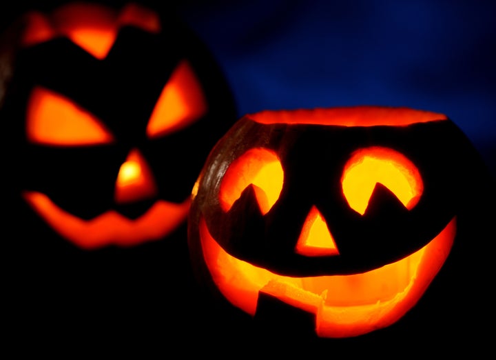 Scary halloween pumpkins jack-o-lantern on black background