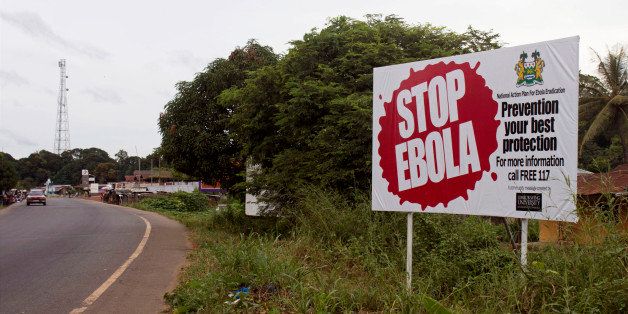 In this photo taken on Tuesday, Oct. 21, 2014, a billboard reading 'Stop Ebola' on the Masiaka Highway, forming part of a trans-West African highway, which links all West African States, on the outskirts of the capital city of Conakry, Guinea. Despite stringent infection-control measures, the risk of Ebolaￃﾢￂﾀￂﾙs spread cannot be entirely eliminated, Doctors Without Borders said Friday, Oct. 24, 2014, after one of its doctors caught the dreaded disease while working in Guinea and went to New York City. (AP Photo/ Youssouf Bah)