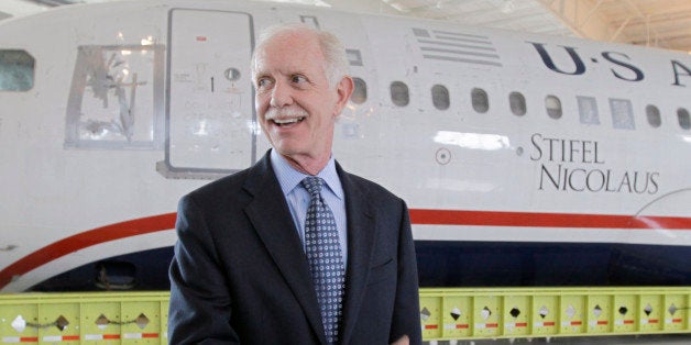 Former Capt. Chesley "Sully" Sullenberger talks to the media in front of the US Airways flight 1549 aircraft at the Carolina Aviation Museum, Saturday, June 11, 2011, in Charlotte, N.C. The plane that made a miraculous landing on the Hudson River two years ago will be displayed in the museum in Charlotte. (AP Photo/Chuck Burton)