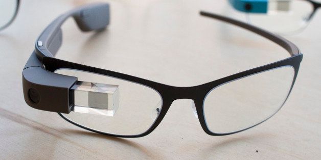 The new Google Glass "Bold" prescription frames in "shale" color rests on a table at the Google Glass Basecamp space at Chelsea Market, Friday, Jan. 24, 2014, in New York. (AP Photo/John Minchillo)
