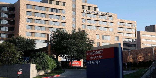 The emergency entrance to Texas Health Presbyterian hospital, Sunday, Oct. 12, 2014, in Dallas, Texas. Hospital officials have said they are no longer accepting new patients at this time after a healthcare worker, who was caring for Ebola patient Thomas Eric Duncan, tested positive for the disease in preliminary tests. (AP Photo/Brandon Wade)