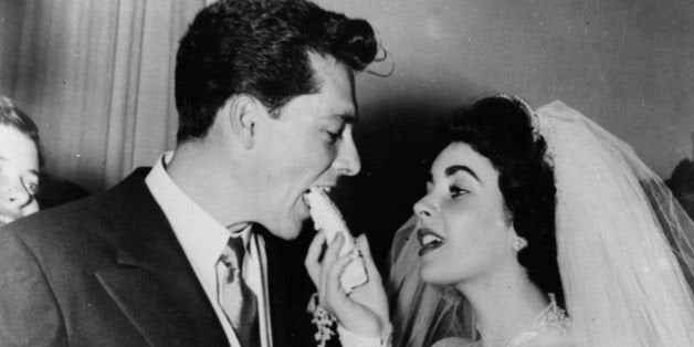 US film star Elizabeth Taylor and her first husband Nick Hilton, of the hotelier family, on their wedding day. (Photo by Keystone/Getty Images)