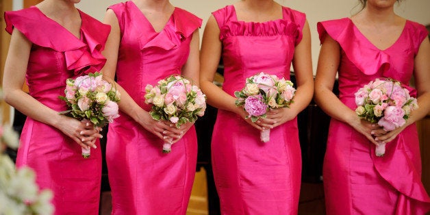 row of bridesmaids with...