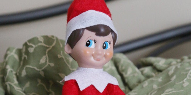 Elf on a Shelf gets comfortable in the guest room.