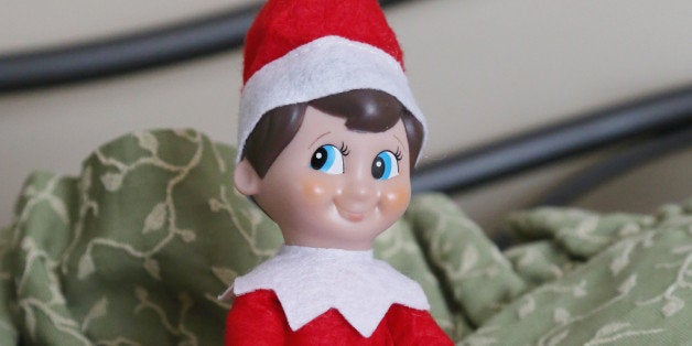 Elf on a Shelf gets comfortable in the guest room. 