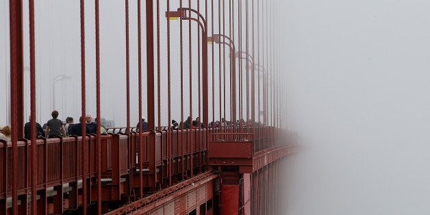 SAN FRANCISCO, CA - JUNE 27: The span of the Golden Gate Bridge disappears into the fog on June 27, 2014 in San Francisco, California. The Golden Gate Bridge district's board of directors voted unanimously to approve a $76 million funding package to build a net suicide barrier on the iconic span. Over 1,500 people committed suicide by jumping from the iconic bridge since it opened in 1937. 46 people jumped to their death in 2013. (Photo by Justin Sullivan/Getty Images)