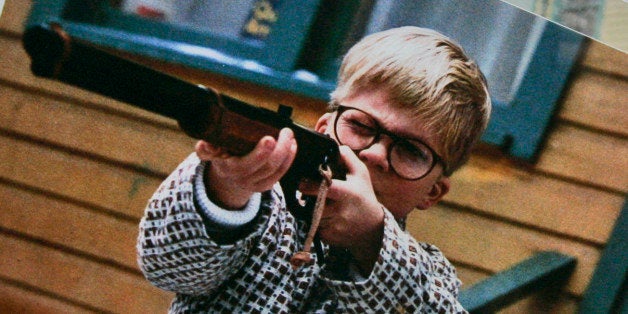 A photo of the character Ralphie, played by actor Peter Billigsley, firing his Red Ryder air rifle from the classic movie 'A Christmas Story' is seen in the back yard of the house used in the filming of the movie in Cleveland, Monday, Nov. 13, 2006. Brian Jones, who had started a business selling the leg lamp made famous in the film, has bought the house and has renovated it as a museum. (AP Photo/Amy Sancetta)