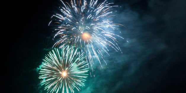 Gorgeous green, blue and purple fireworks against a cloud of smoke that looks like the Milky Way. The sort of thing you would see at New Year's, July 4th or other public holidays.