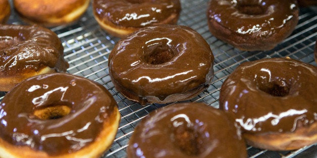 SOMERVILLE, AM - MARCH 23: 'Donut wrangler' Alejandro Strong prepares chocolate chipotle donuts at Union Square Donuts in Somerville. (Photo by Aram Boghosian for The Boston Globe via Getty Images)