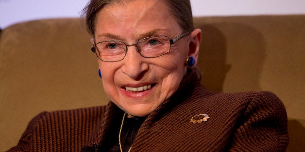 FILE - In this Dec. 17, 2013 file photo, Supreme Court Justice Ruth Bader Ginsburg smiles while speaking to the Northern Virginia Technology Council in Reston, Va. A Supreme Court spokeswoman says Justice Ruth Bader Ginsburg has been released from the hospital after having a heart stent implanted to clear a blocked artery. Spokeswoman Kathy Arberg says the 81-year-old jurist was sent home Thursday and is expected to be at work when the court hears its next round of oral arguments on Monday, Dec. 1, 2014. (AP Photo/Jacquelyn Martin, File)