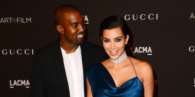 Kanye West, left, and Kim Kardashian arrive at the LACMA Art + Film Gala at LACMA on Saturday, Nov. 1, 2014, in Los Angeles. (Photo by Jordan Strauss/Invision/AP)