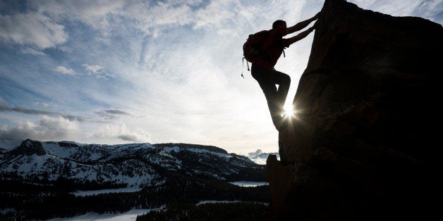 mountain climber going to the summit 