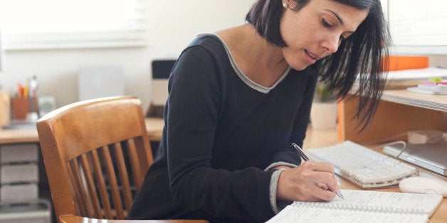 Hispanic woman working in home office