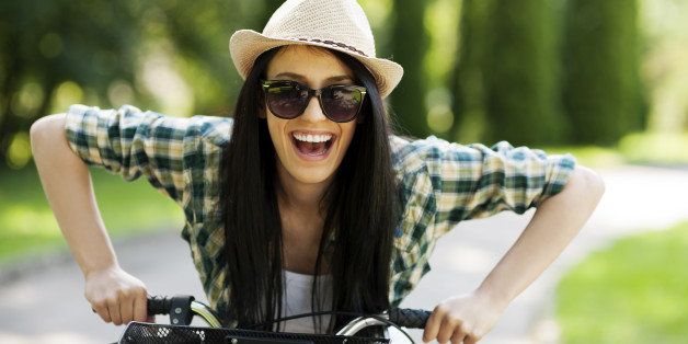 happy young woman with bicycle