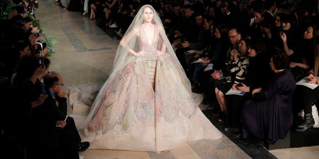 A model wears a creation by fashion designer Elie Saab during his Spring-Summer 2015 Haute Couture fashion collection, presented in Paris, France, Wednesday, Jan. 28, 2015. (AP Photo/Christophe Ena)