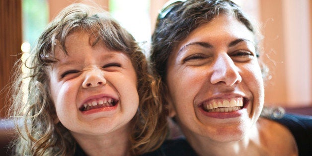 Mother and daughter smiling