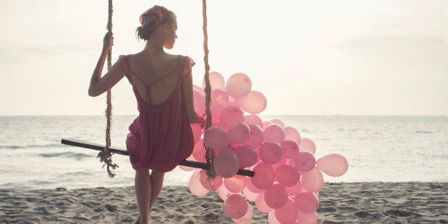 beautiful women at swing with pink ballons