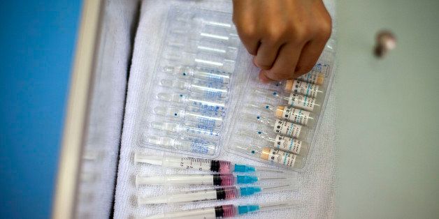A nurse prepares vaccine shots against measles at a clinic in Beijing, China, Saturday, Sept. 11, 2010. China wants to vaccinate nearly 100 million children in a 10-day nationwide campaign starting Saturday to bring it a step closer to eradicating measles. (AP Photo/Alexander F. Yuan)