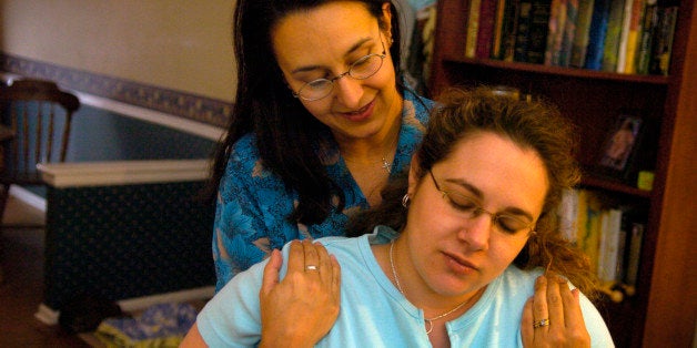 AURORA, CO (05-04-2006) -- Certified Labor Doula Ana Hill, left, is helping Leanne Stiles prepare for her upcoming birth. Ana assisted Leanne during her first pregnancy too. The word doula comes from the Greek word for the most important female slave or servant in an ancient Greek household, the woman who probably helped the lady of the house through her childbearing. (DENVER POST PHOTO BY KARL GEHRING) (Photo By Karl Gehring/The Denver Post via Getty Images)