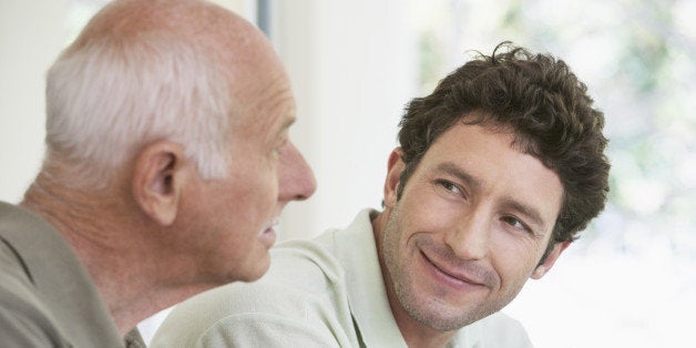 Caucasian father and son smiling