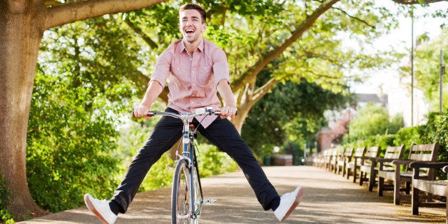 Man with legs in air on bike