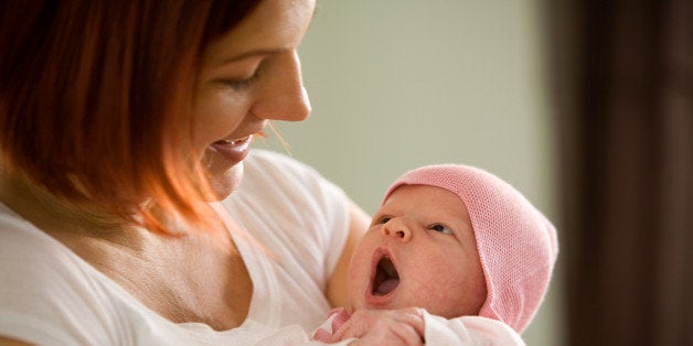 Mother holding newborn baby girl