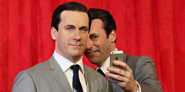 NEW YORK, NY - MAY 09: Actor Jon Hamm takes a selfie as he unveils Don Draper's wax figure during Mad Men's Final Season at Madame Tussauds New York on May 9, 2014 in New York City. (Photo by Cindy Ord/Getty Images for Madame Tussauds)