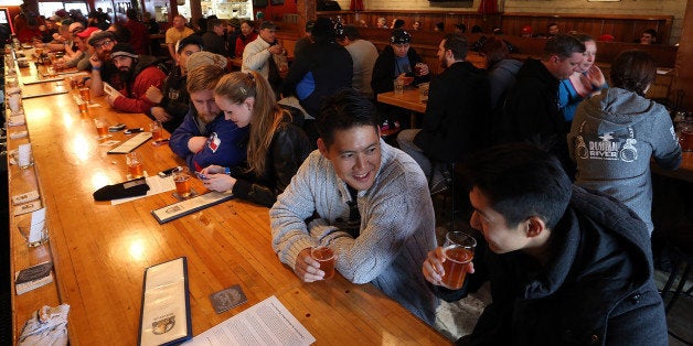 SANTA ROSA, CA - FEBRUARY 07: Russian River Brewing Company customers drink the newly released Pliny the Younger triple IPA beer on February 7, 2014 in Santa Rosa, California. Hundreds of people lined up hours before the opening of Russian River Brewing Co. to taste the 10th annual release of the wildly popular Pliny the Younger triple IPA beer that will only be available on tap from February 7th through February 20th. Craft beer aficionados rank Pliny the Younger as one of the top beers in the world. The craft beer sector of the beverage industry has grown from being a niche market into a fast growing 12 billion dollar business, as global breweries continue to purchase smaller regional craft breweries such this weekᅢテᅡユs purchase of New Yorkᅢテᅡユs Blue Point Brewing by AB Inbev. (Photo by Justin Sullivan/Getty Images)
