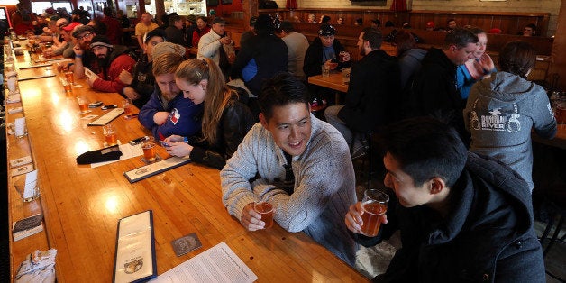 SANTA ROSA, CA - FEBRUARY 07: Russian River Brewing Company customers drink the newly released Pliny the Younger triple IPA beer on February 7, 2014 in Santa Rosa, California. Hundreds of people lined up hours before the opening of Russian River Brewing Co. to taste the 10th annual release of the wildly popular Pliny the Younger triple IPA beer that will only be available on tap from February 7th through February 20th. Craft beer aficionados rank Pliny the Younger as one of the top beers in the world. The craft beer sector of the beverage industry has grown from being a niche market into a fast growing 12 billion dollar business, as global breweries continue to purchase smaller regional craft breweries such this weekￃﾃￂﾕs purchase of New Yorkￃﾃￂﾕs Blue Point Brewing by AB Inbev. (Photo by Justin Sullivan/Getty Images)