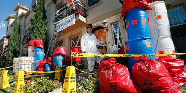 UNIVERSITY PARK, TX - OCTOBER 26: Dallas-area resident James Faulk displays his Ebola-themed Halloween decorations on October 26, 2014 in University Park, Texas. Faulk decorated the front of his house and lawn to resemble the scene of the Dallas apartment where the first U.S. case of Ebola virus was confirmed several weeks ago. Faulk has set up a Twitter account and a website in an effort to raise funds for the Doctors Without Borders charity organization. (Photo by Tom Pennington/Getty Images)