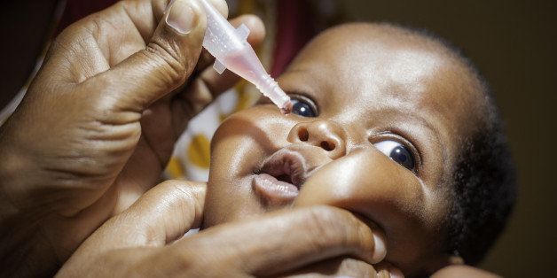 An East African baby receiving a Polio vaccination.