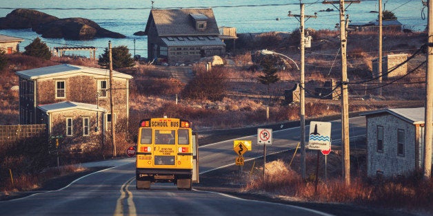 A school bus departs from a pickup on Nova Scotia's Lighthouse Route.