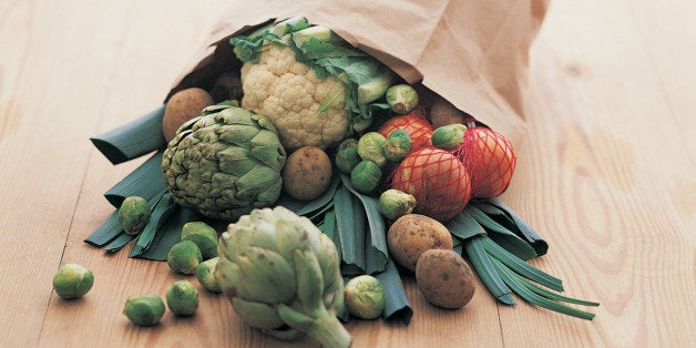 Paper Bag Full of Vegetables on a Table