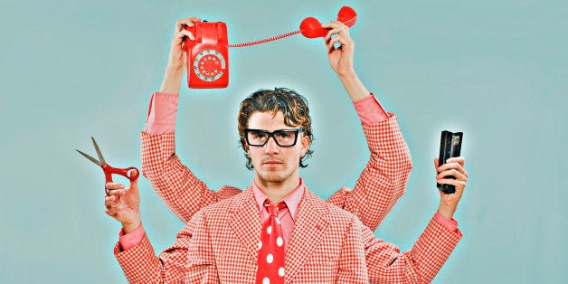 Multi Tasking Man at Desk with Six Arms