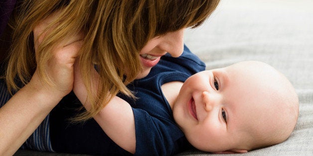 Mother and baby son face to face