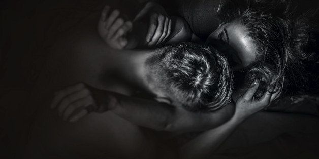 Passionate couple in bed