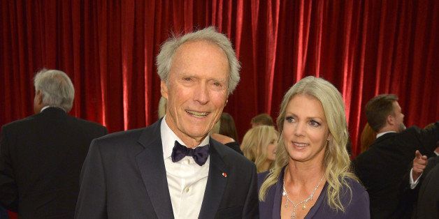 HOLLYWOOD, CA - FEBRUARY 22: Director Clint Eastwood (L) and Christina Sandera attend the 87th Annual Academy Awards at Hollywood & Highland Center on February 22, 2015 in Hollywood, California. (Photo by George Pimentel/Getty Images)