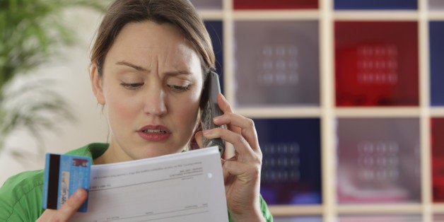 Woman paying bills by phone