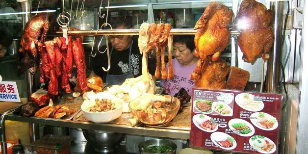 Closer to my hotel, here is where I eventually picked up my lunch: from this hawker centre at the Teka market on Serangoon Road. Note Peking Duck and other fried items of animal origin on display. (Oct. 2009)