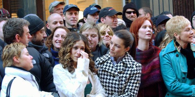 UNITED STATES - FEBRUARY 02: Sarah Jessica Parker wipes tears from her eyes as she's held by co-star Kristin Davis in SoHo after finishing a scene for the last episode of 'Sex and the City.' They're joined by fellow cast mates Cynthia Nixon (2nd right) and Kim Cattrall (right) as the surrounding crew bid them farewell. Shooting was wrapped up for the TV series' sixth and final season this week. (Photo by Richard Corkery/NY Daily News Archive via Getty Images)