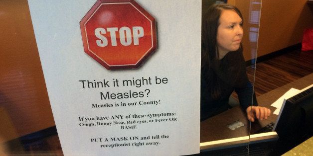 A sign warns of the dangers of measles in the reception area of a pediatrician's office in Scottsdale, Ariz., Saturday, Feb. 7, 2015. Health officials in the state continue to see cases of the disease which had been eradicated in the U.S. (AP Photo/Tom Stathis)