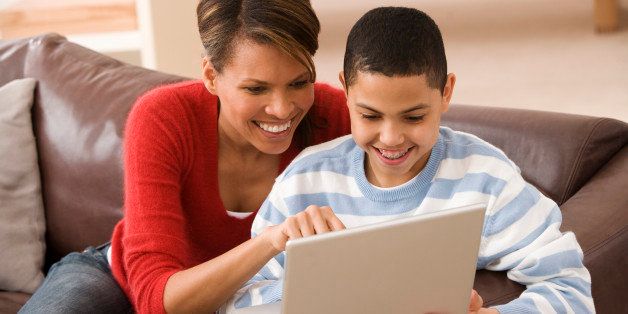 Mother and son with laptop